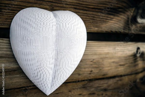 Obraz Plastic lonely heart hanging on a wooden wall