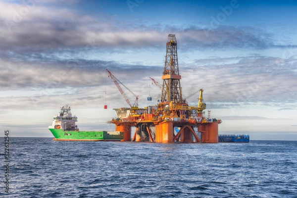 Obraz Supply vessel during operation along side with a drilling rig