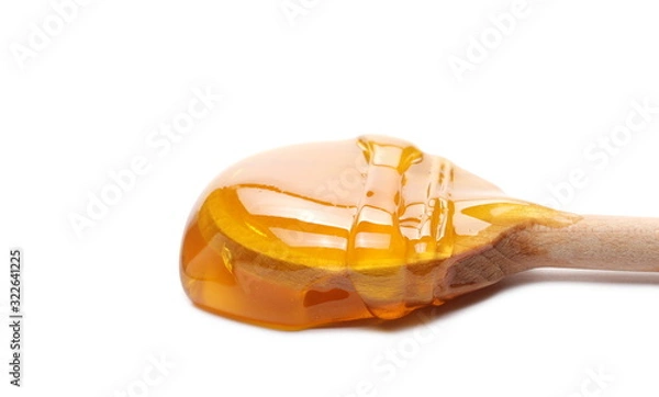 Obraz Honey with wooden spoon isolated on white background