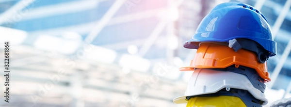 Fototapeta Multicolored Safety Construction Worker Hats. Teamwork of the construction team must have quality. Whether it is engineering, construction workers. Have a helmet to wear at work. For safety at work.