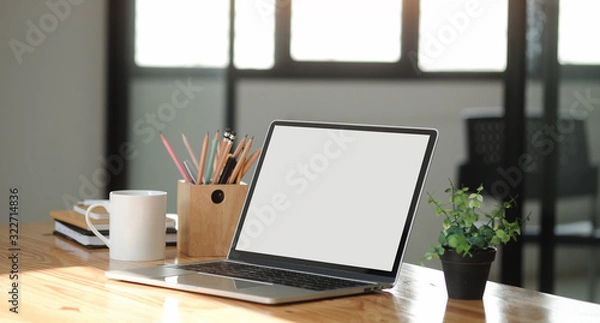 Fototapeta Workspace desk and laptop. copy space and blank screen. Business image, Blank screen laptop and supplies.
