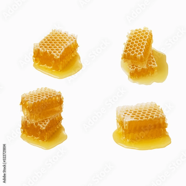 Obraz Isolated honey. Four honeycomb pieces isolated on white background, package design element.