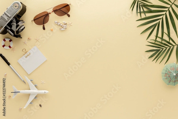 Fototapeta Holidays Travel. Palm leaf Hat sunglasses summer background with copy space for your text. Flat lay, top view.