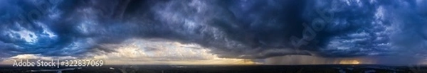 Fototapeta Flying over the forest towards thunderclouds. Karelia