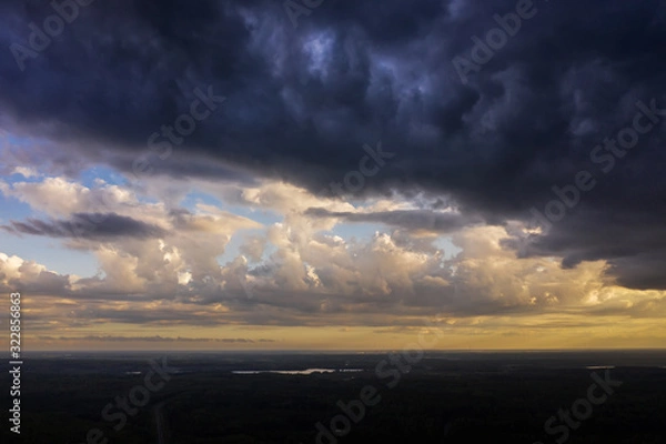 Fototapeta Aerial view of heavy thunderclouds over the forest of Karelia
