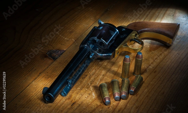 Fototapeta Wild West Revolver with Shells on table