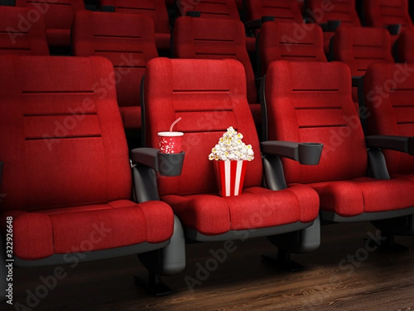 Fototapeta Spotlit red cinema chair with popcorn and soda. 3D illustration