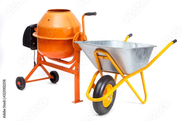 Fototapeta Concrete mixer and cart on an isolated white background.