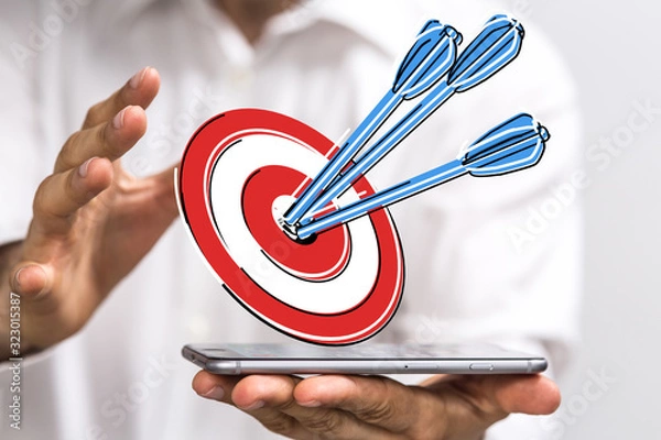 Fototapeta  makes a dart throw on the target. The concept of persistence in business..