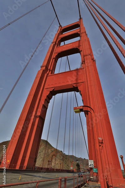 Fototapeta Golden Gate Bridge pylon. Abstract view of an icon.