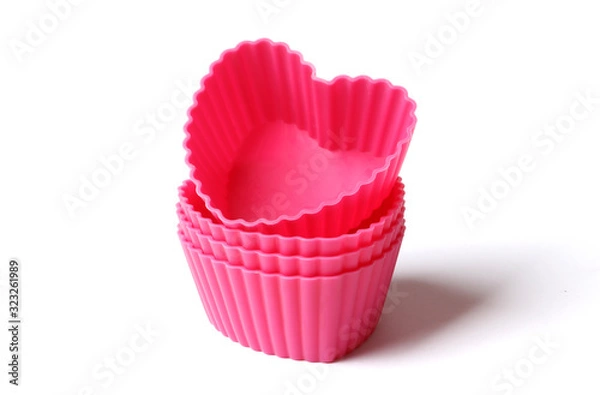 Fototapeta silicone mold for baking on a white background. Culinary accessories of the baker. Small baking cups. It is isolated.