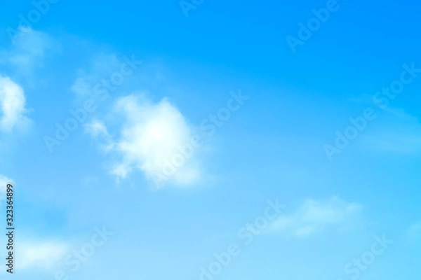 Fototapeta ิblue sky against white floating clouds background