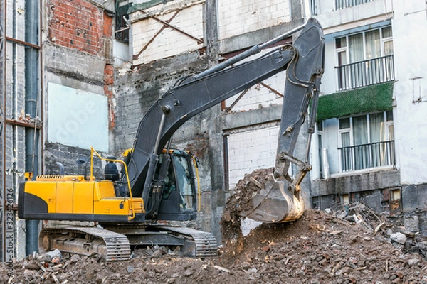 Obraz Building demolition with excavator