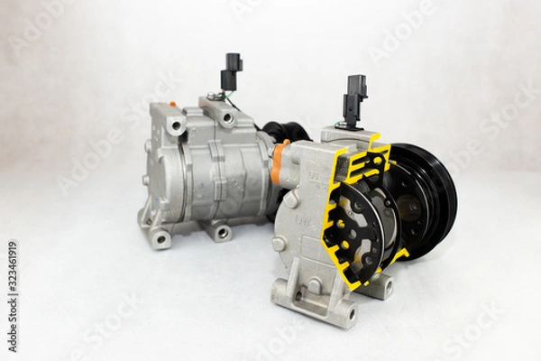 Fototapeta New car compressor with cutted car compressor on white background