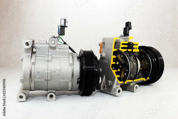 Fototapeta New car compressor with cutted car compressor on white background