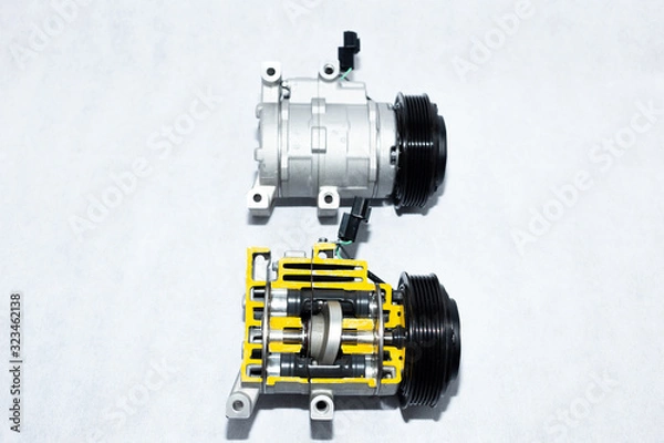 Fototapeta New car compressor with cutted car compressor on white background