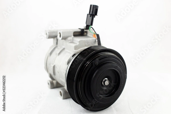 Fototapeta New car air conditioning compressor on white background