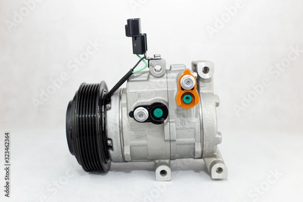 Fototapeta New car air conditioning compressor on white background