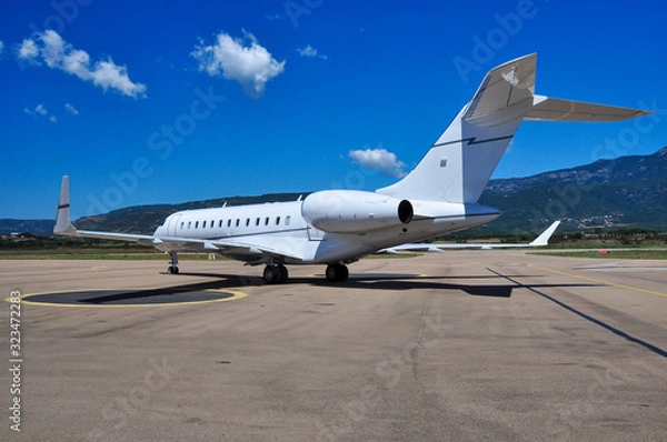Obraz Beautiful private business jet Gulfstream G5 on the tarmac of Figari airport. Super rich lifestyle during summertime.