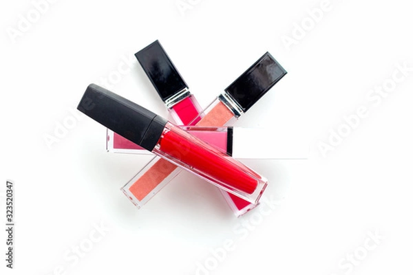 Obraz Lipgloss Pyramid. Lip gloss on a white background. Beauty background. Cosmetics concept. Flat lay