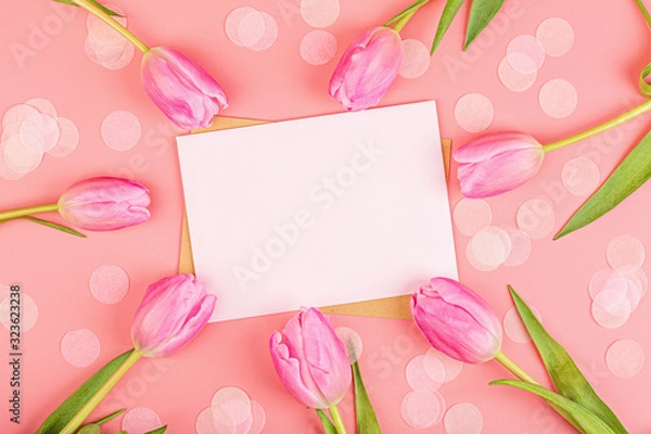 Fototapeta View from above tulips and blank of paper with copy space. Background for womens day, 8 March Valentines day, 14 february. Flat lay style, top view, mockup, template, overhead. Greeting card