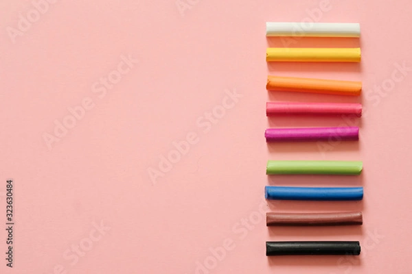 Obraz Colorful pastel crayons on pink background with copy space. Art, drawing concept