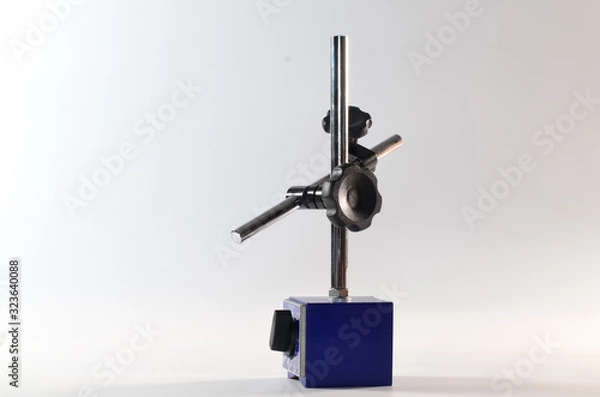 Fototapeta The magnetic base stands on a white background inside