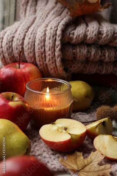 Obraz Layout of candles, apples and a knitted scarf