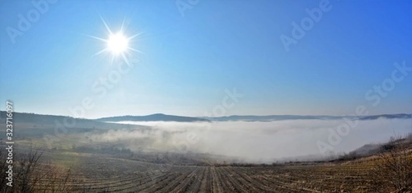 Fototapeta landscape with fog between hills