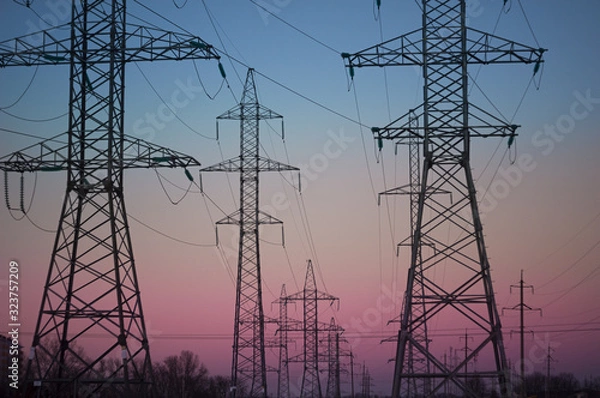 Obraz electricity pylons at sunset