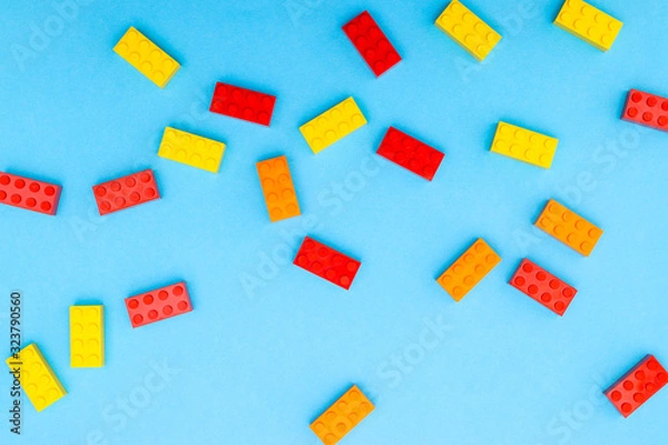 Fototapeta Plastic bricks for kids in different colors on the table