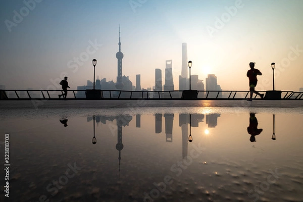 Fototapeta The unspecific people are exercise in this area. And Shanghai Bund historical buildings old colonial buildings, Popular tourist destination, China.