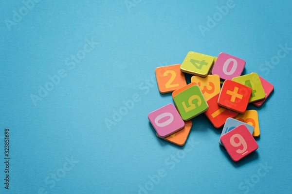 Fototapeta School background - numbers on blue background with copy space. Mathematics concept, math