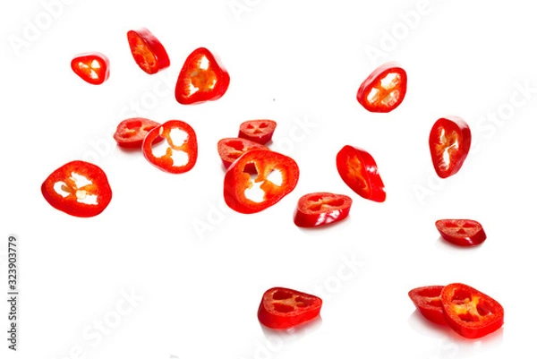 Fototapeta Chili pepper and its slices close-up falling