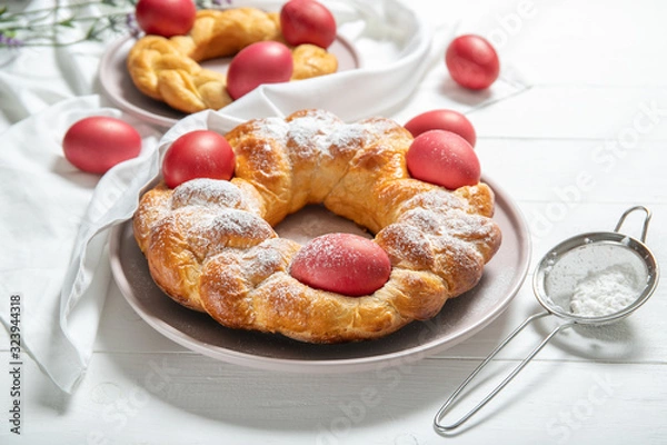 Fototapeta Tasty easter bread. Easter bread and red eggs. Italian easter bread