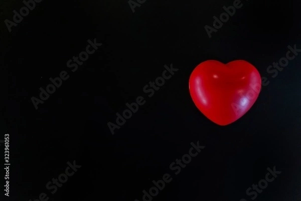 Obraz red heart on black background