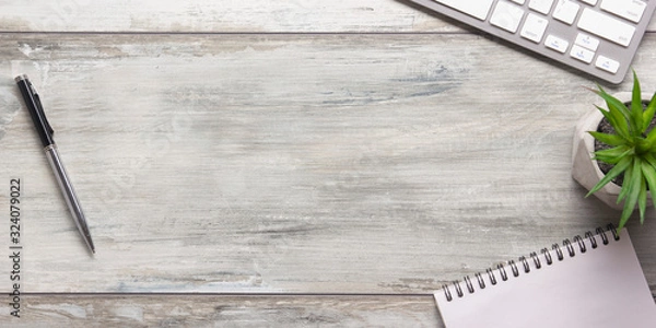 Obraz White desk office with laptop, smartphone and other work supplies with cup of coffee. Top view with copy space for input the text. Designer workspace on desk table essential elements on flat lay