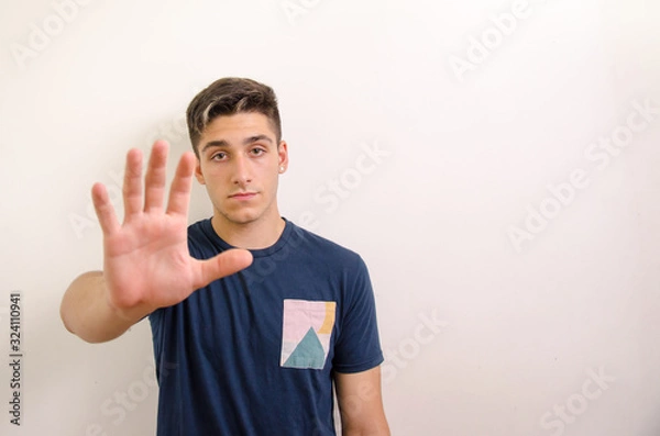 Obraz Young man making stop sign with hand