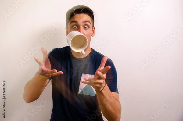 Obraz Young man with a jug in the air