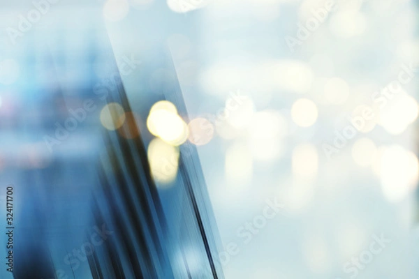 Obraz Streszczenie biznes nowoczesne miasto futurystyczna architektura miejska tło, rozmycie ruchu, odbicie w szkle fasady wieżowca, stonowany niebieski obraz z bokeh. Pojęcie nieruchomości