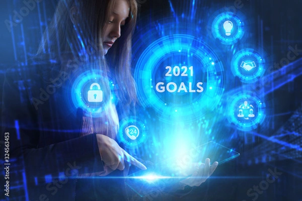Fototapeta Business, Technology, Internet and network concept. Young businessman working on a virtual screen of the future and sees the inscription: 2021 goals