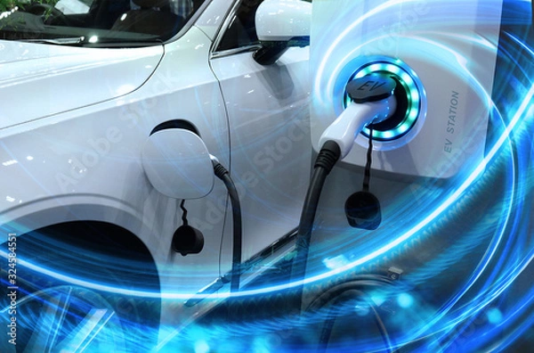 Fototapeta Samochód elektryczny lub pojazd elektryczny na stacji ładującej z podłączonym zasilaczem na niewyraźnej naturze z efektem mocy niebieskiej energii. Ekologiczna koncepcja zrównoważonej energii.