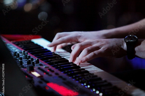 Obraz Keyboard player hands on the stage 