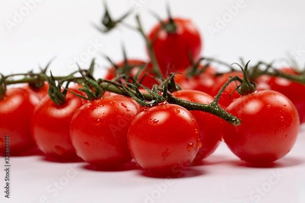 Obraz Ripe cherry tomatoes isolated on white background