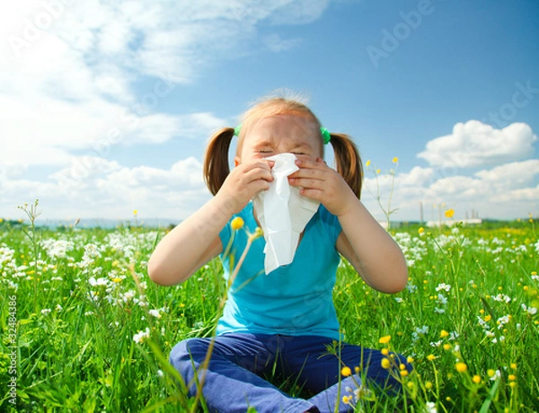 Obraz Little girl is blowing her nose