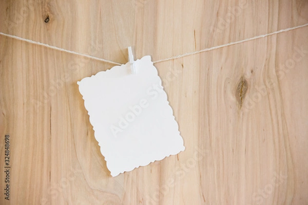 Obraz white sheet on clothespins hang on thread