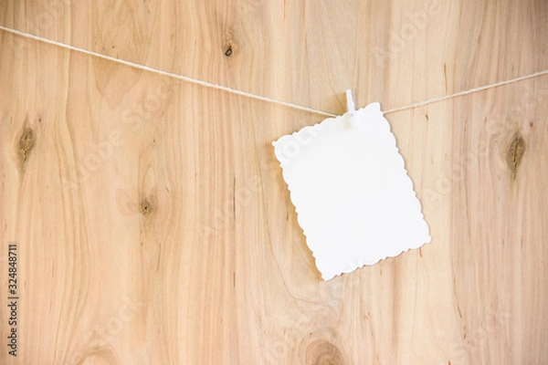 Obraz white sheet on clothespins hang on thread