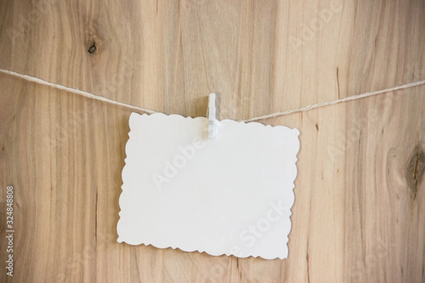 Obraz white sheet on clothespins hang on thread