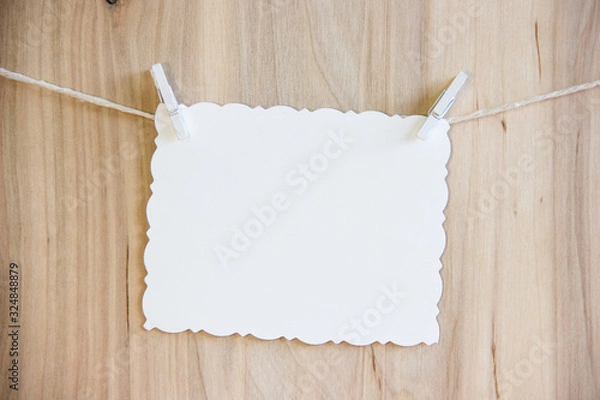 Obraz white sheet on clothespins hang on thread