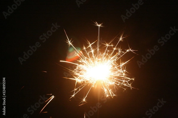 Obraz sparkler on black background